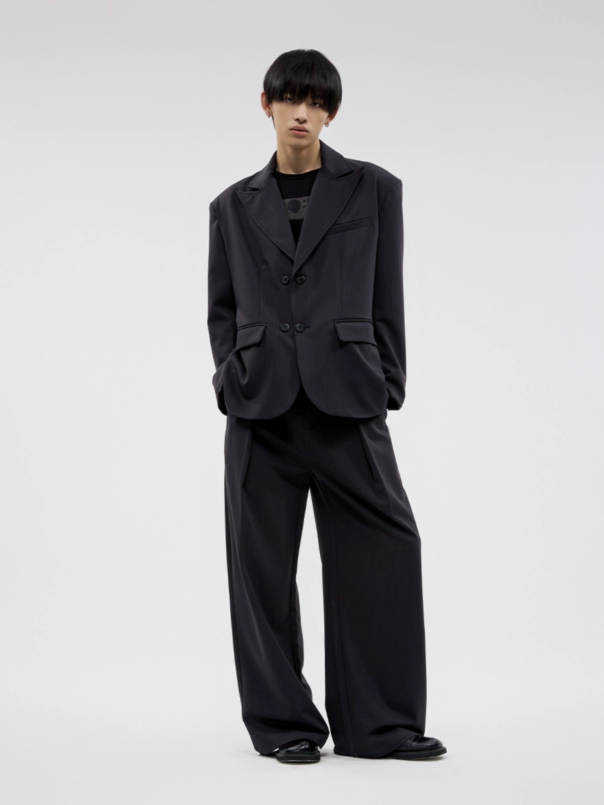 BLACK PLEATED SLACKS