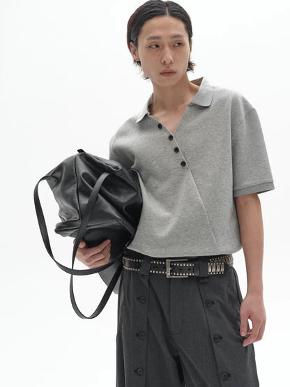 CHIC MISPLACED BUTTON POLO SHIRT
