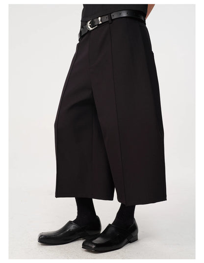 CURVED PLEATED PANTS