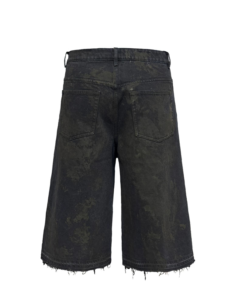 BLACK MUD-DYED DISTRESSED JEANS