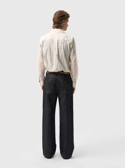 ASYMMETRICAL TWISTED DENIM
