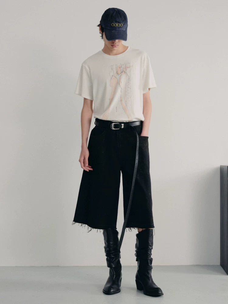 BLACK MUD-DYED DISTRESSED JEANS