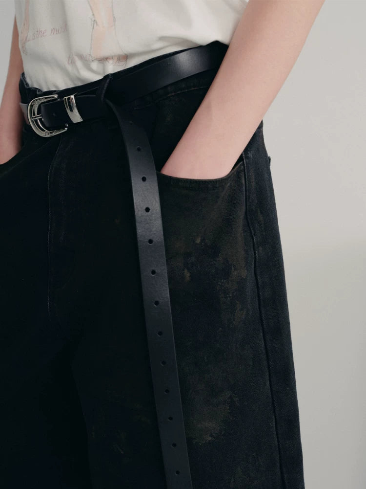 BLACK MUD-DYED DISTRESSED JEANS