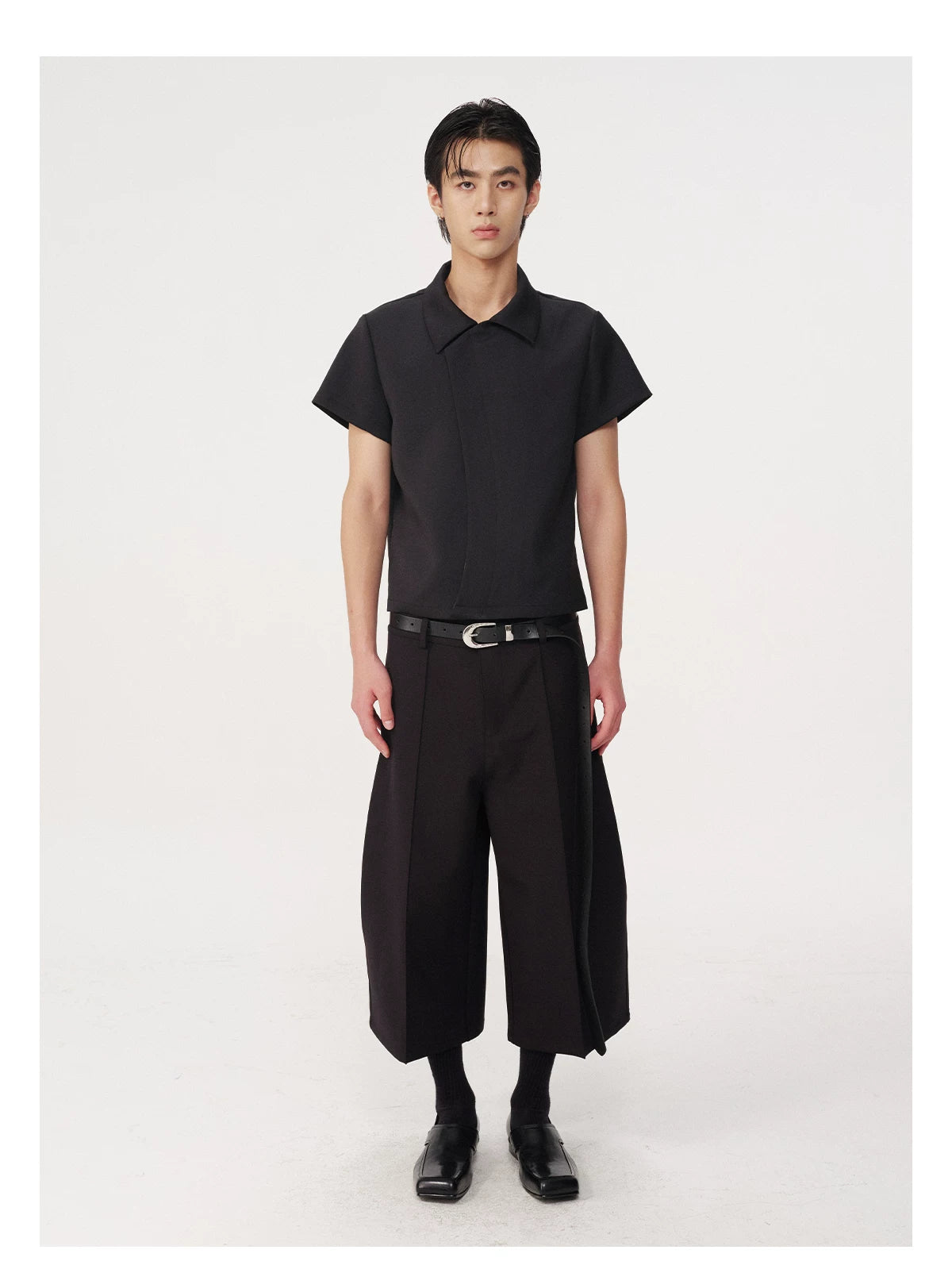 CURVED PLEATED PANTS