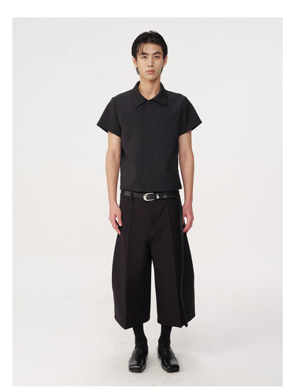 CURVED PLEATED PANTS