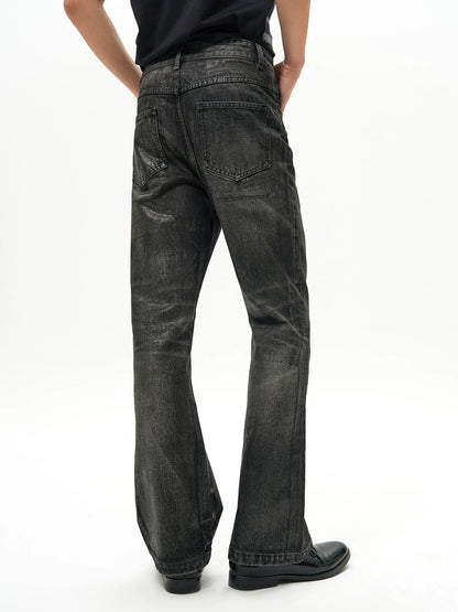 WAXED FLARE DENIM PANTS