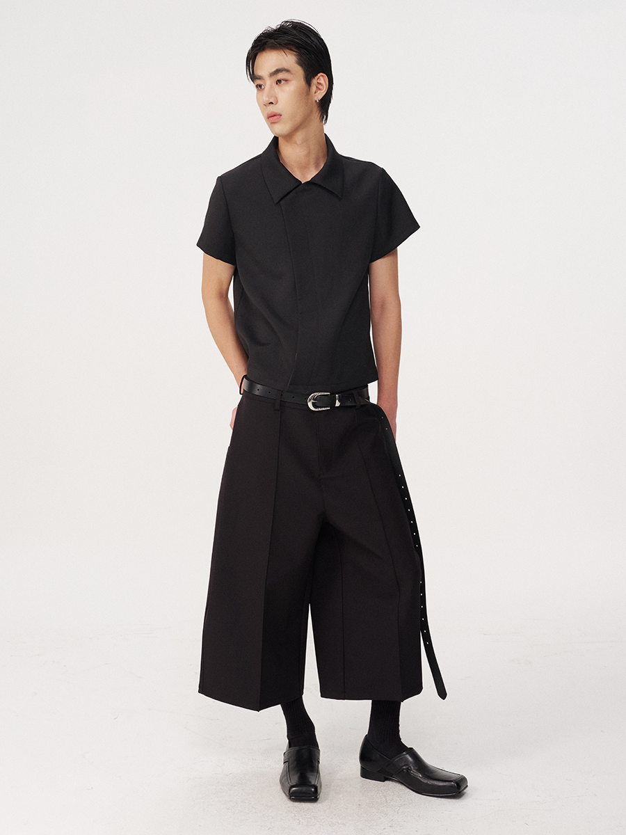 CURVED PLEATED PANTS