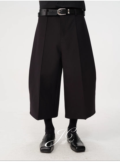 CURVED PLEATED PANTS
