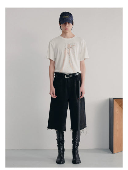BLACK MUD-DYED DISTRESSED JEANS