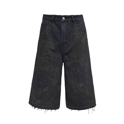 BLACK MUD-DYED DISTRESSED JEANS