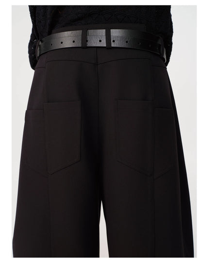 CURVED PLEATED PANTS