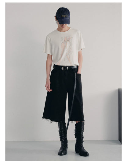 BLACK MUD-DYED DISTRESSED JEANS
