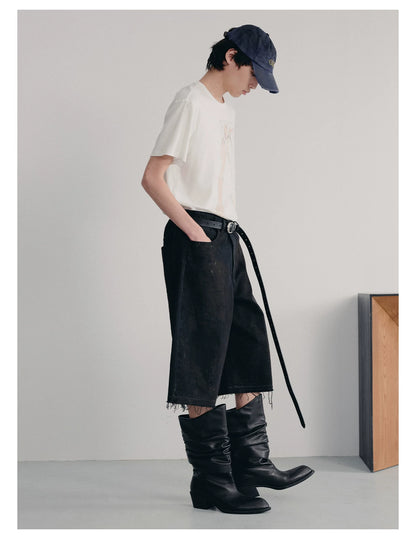 BLACK MUD-DYED DISTRESSED JEANS