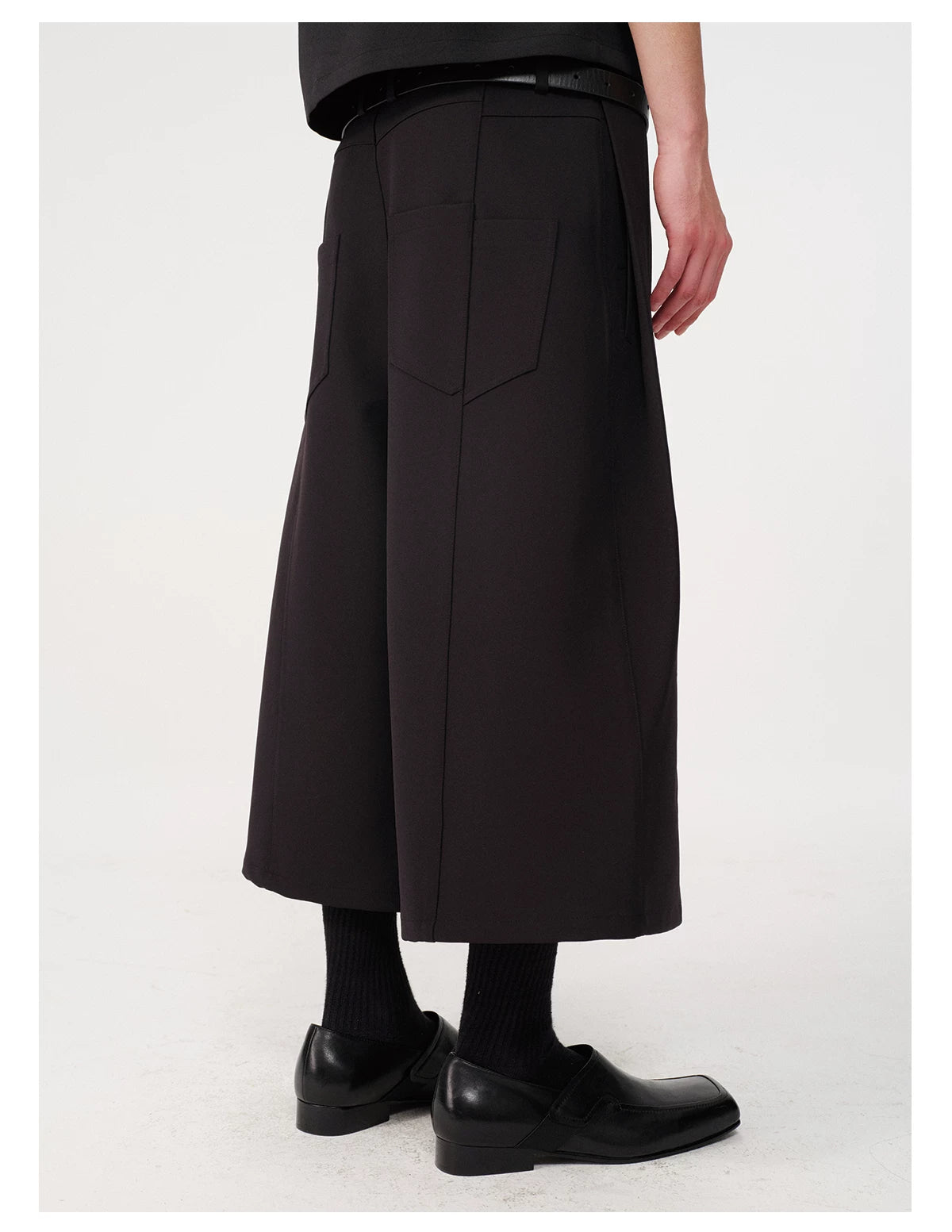 CURVED PLEATED PANTS