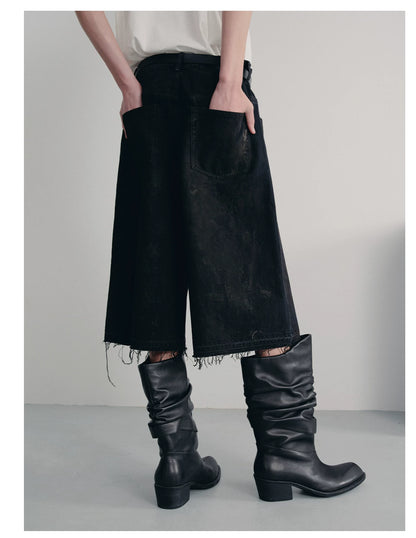 BLACK MUD-DYED DISTRESSED JEANS