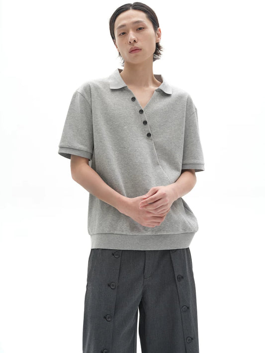 CHIC MISPLACED BUTTON POLO SHIRT