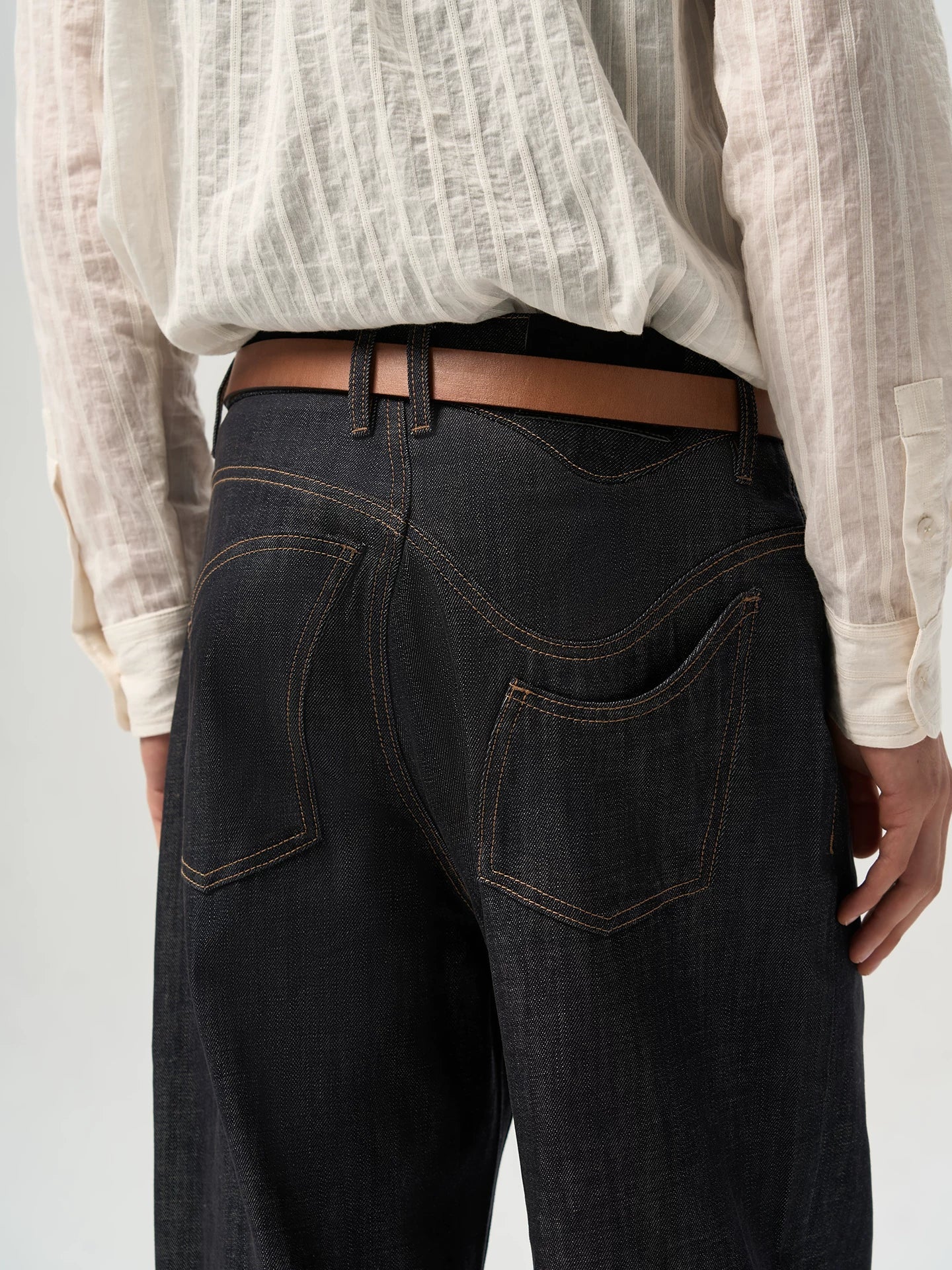 ASYMMETRICAL TWISTED DENIM