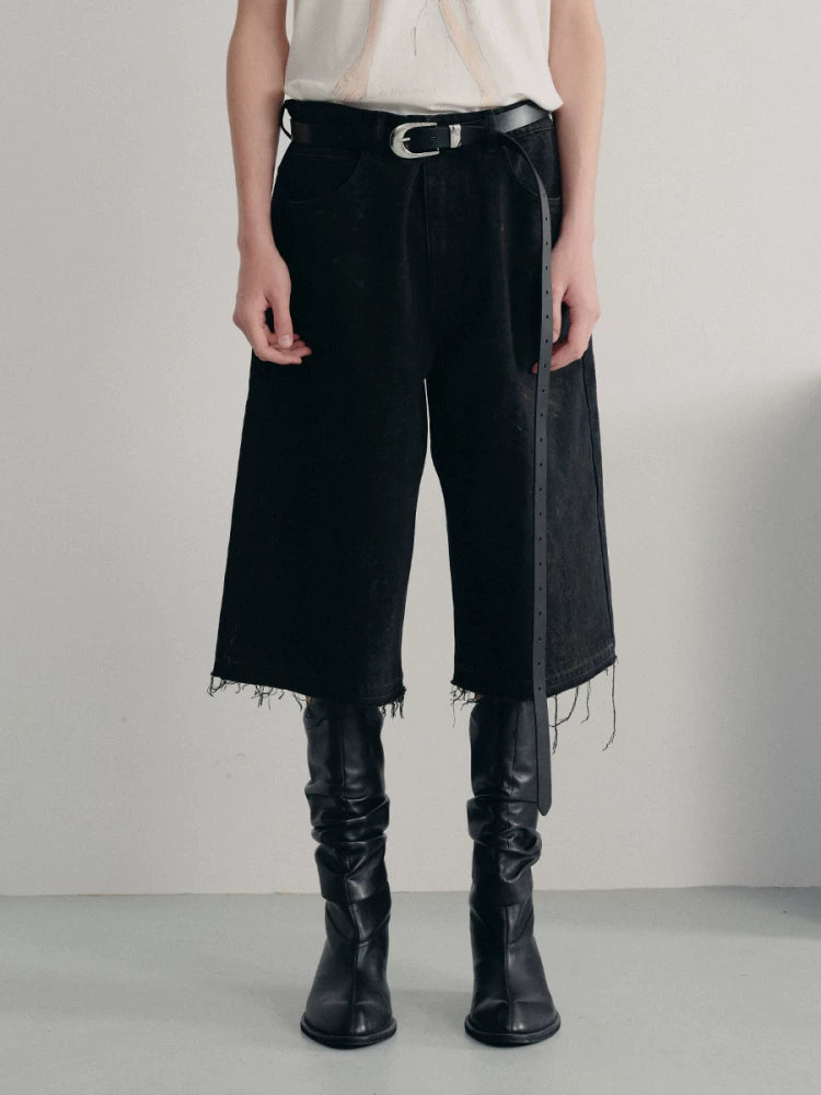 BLACK MUD-DYED DISTRESSED JEANS